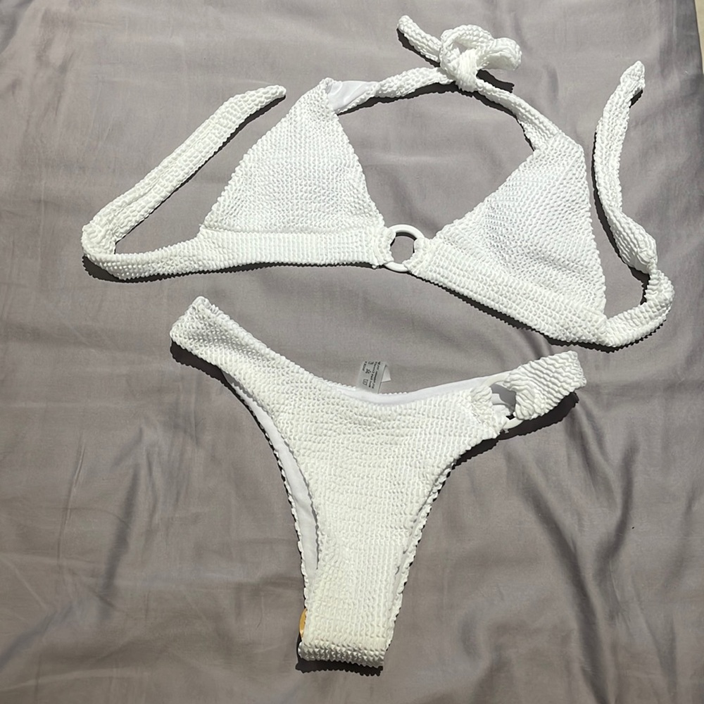 Never worn swimlly suit new with tags!! White textured and so cute classy bikini